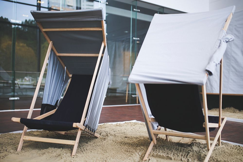 Deck chairs on a beach. Visit Kaboompics for more free images.