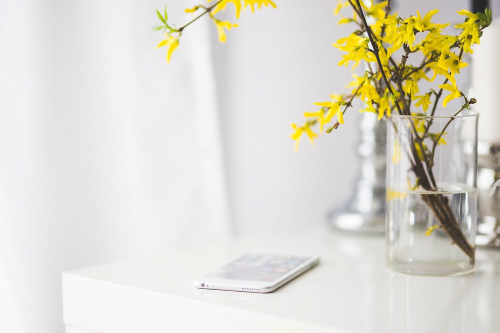 Smartphone on a white desk. Visit Kaboompics for more free images.