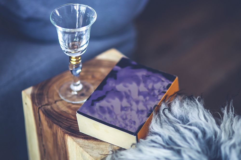 Wine glass and a book. Visit Kaboompics for more free images.