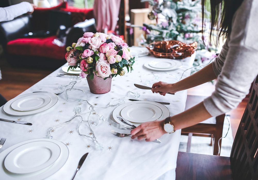 Woman setting the table. Visit Kaboompics for more free images.