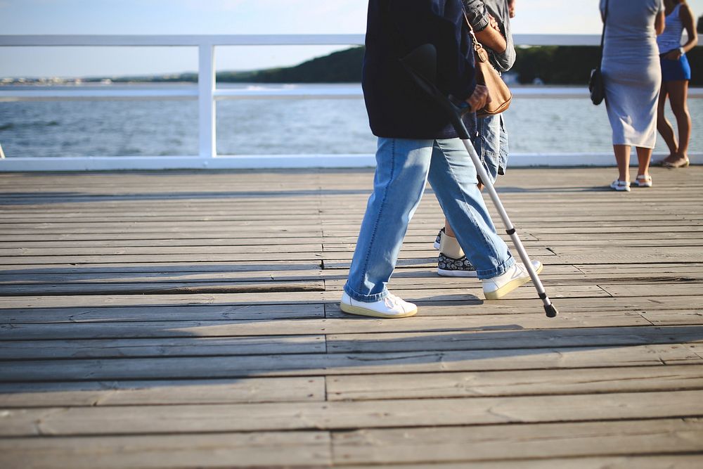 Senior woman walking by a lake. Visit Kaboompics for more free images.