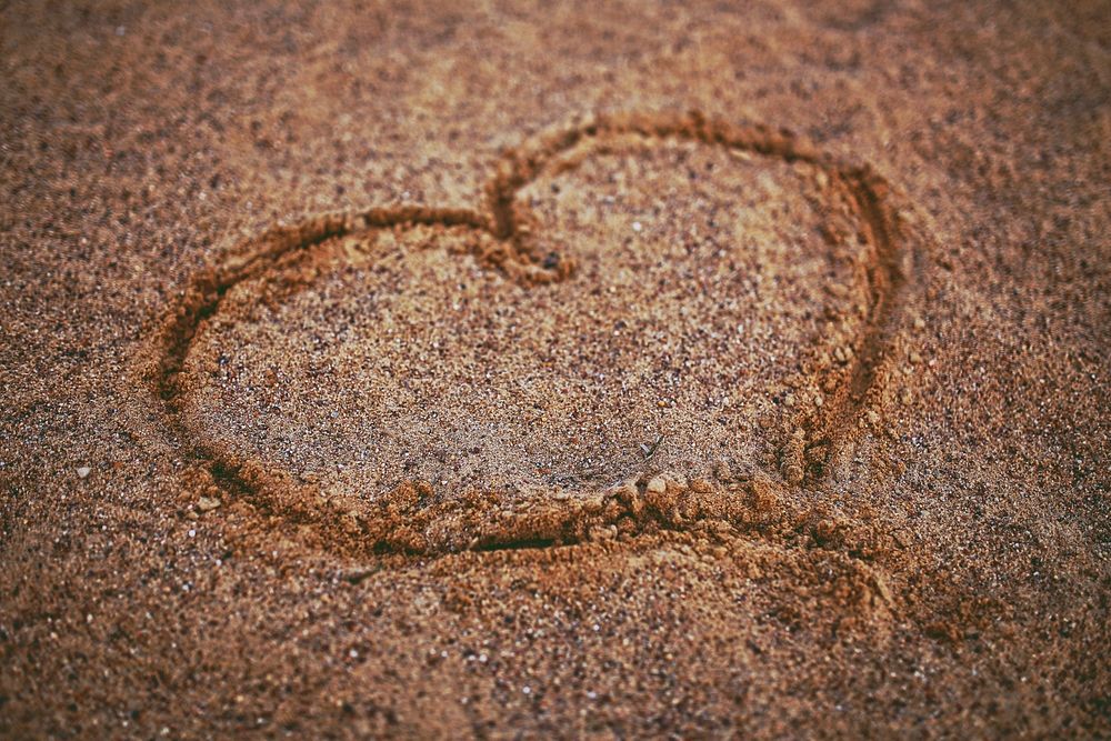 Heart drawn in the sand. Visit Kaboompics for more free images.