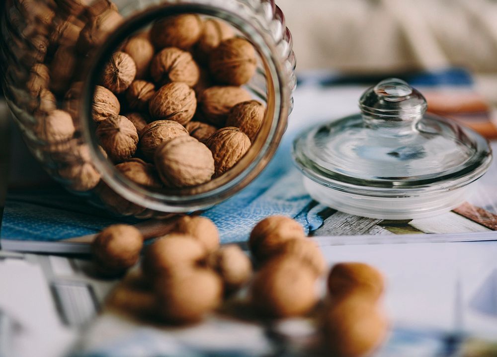 A jar full of walnuts. Visit Kaboompics for more free images.