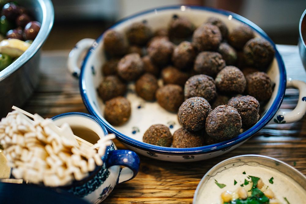 Lebanese dinner with pita and falafel. Visit Kaboompics for more free images.