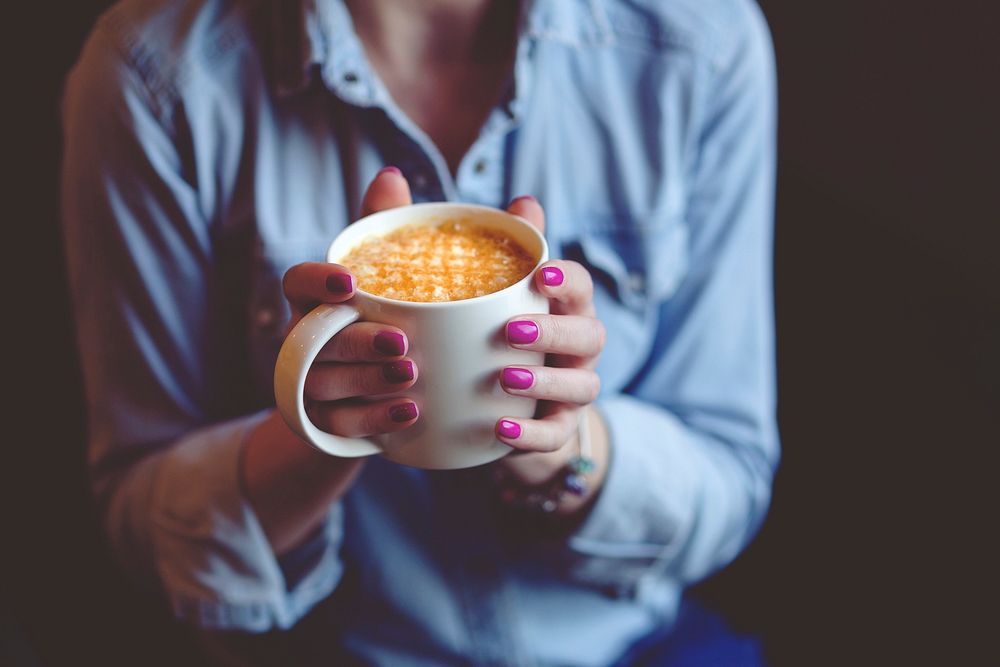 Woman drinking a hot chocolate. Visit Kaboompics for more free images.