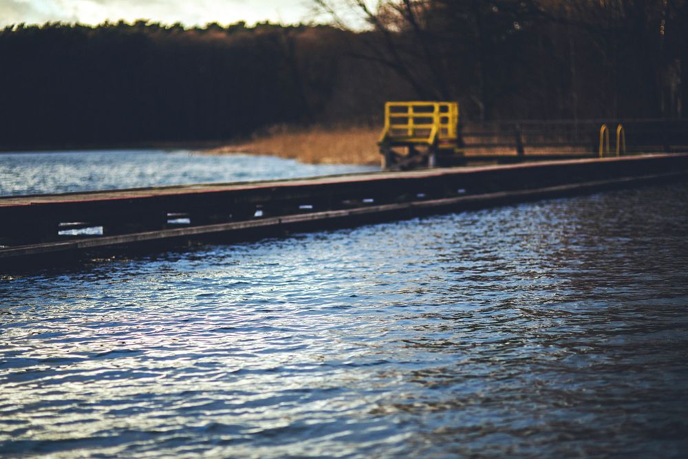 Old wooden pier by a lake. Visit Kaboompics for more free images.