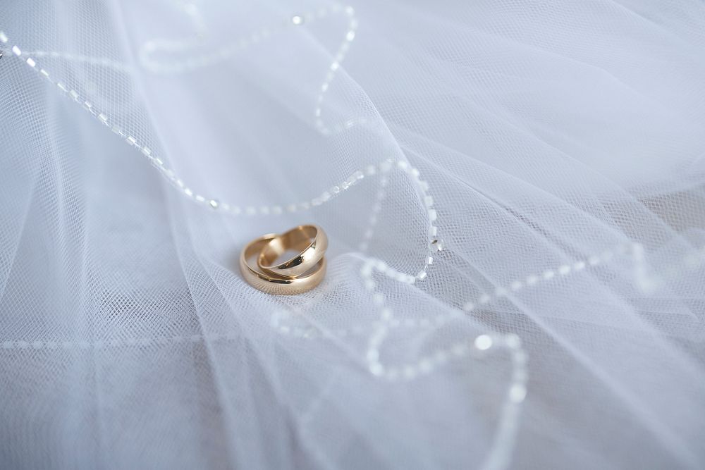 Gold engagement ring on a veil. Visit Kaboompics for more free images.