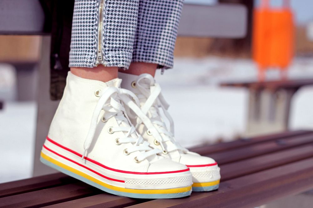Close up of a woman in sneakers. Visit Kaboompics for more free images.