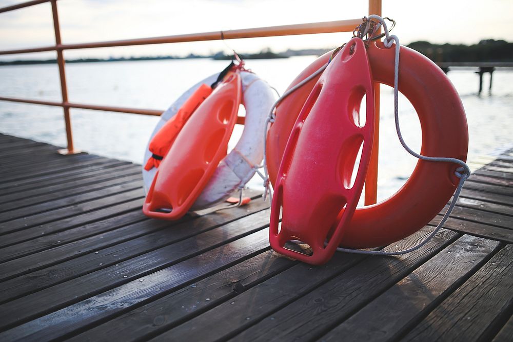 Lifebuoy on a pier. Visit Kaboompics for more free images.
