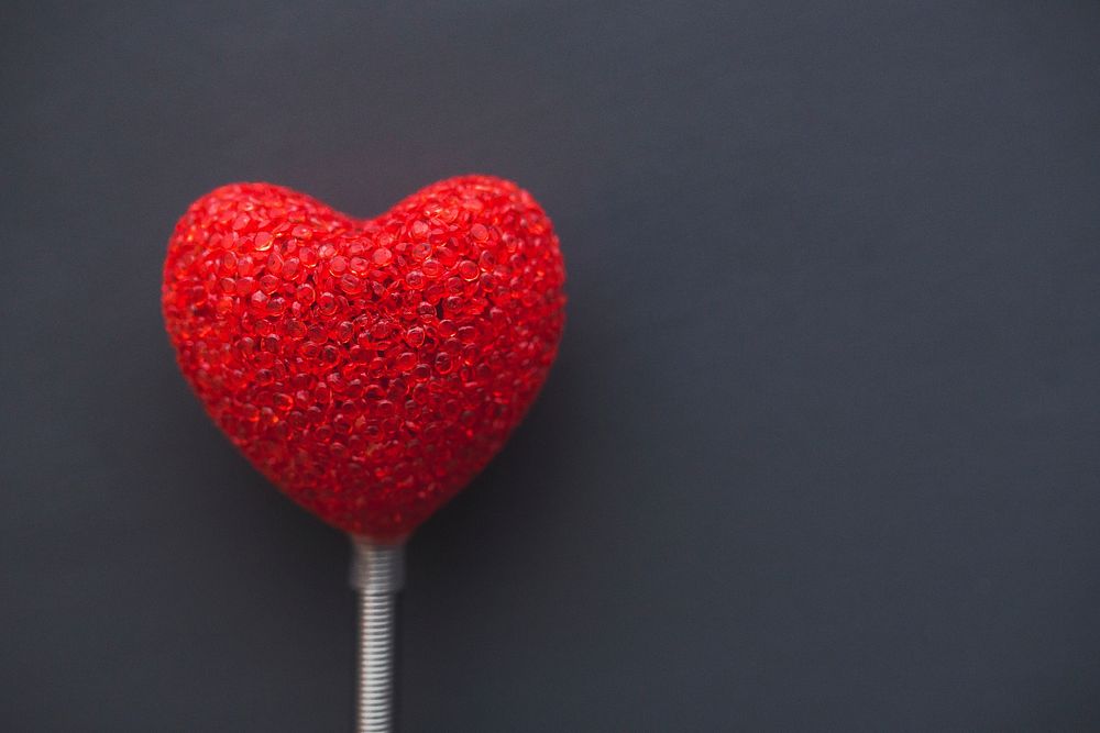 Red heart on a stick. Visit Kaboompics for more free images.