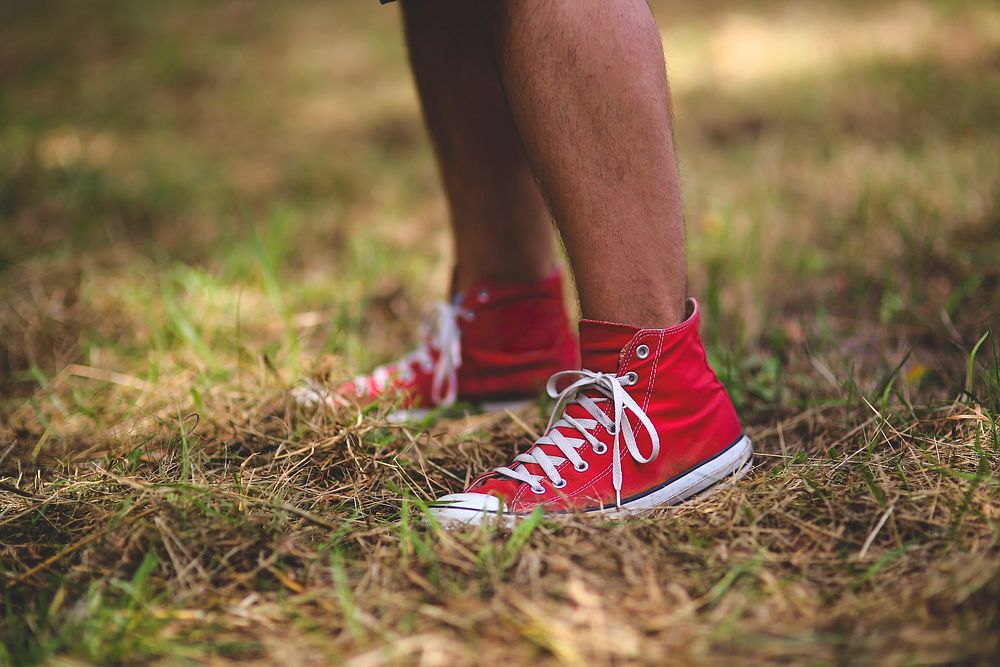 Man wearing red sneakers. Visit Kaboompics for more free images.