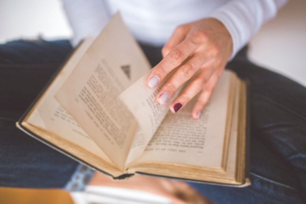 Woman reading a book. Visit Kaboompics for more free images.