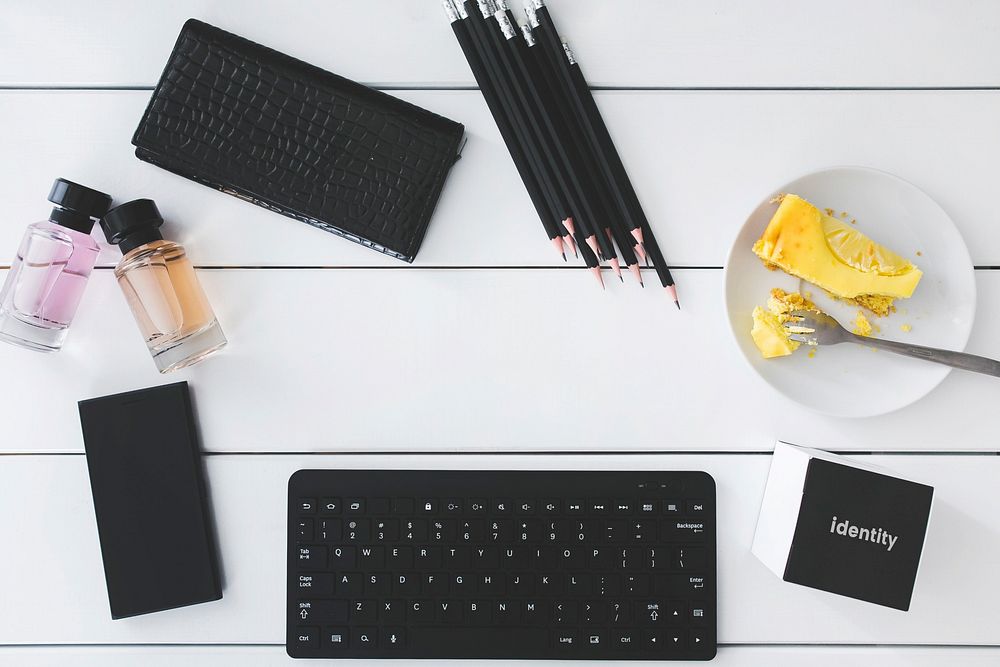 Black keyboard and stationary flat lay. Visit Kaboompics for more free images.