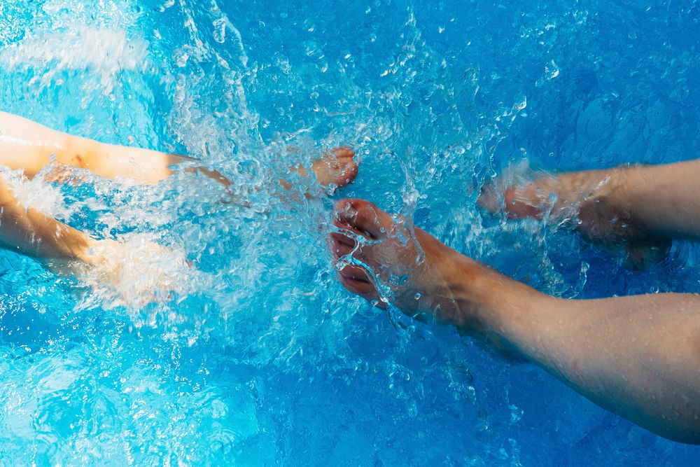 People splashing in a pool