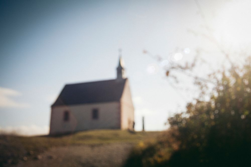 Blurred photo of a church in a remote area