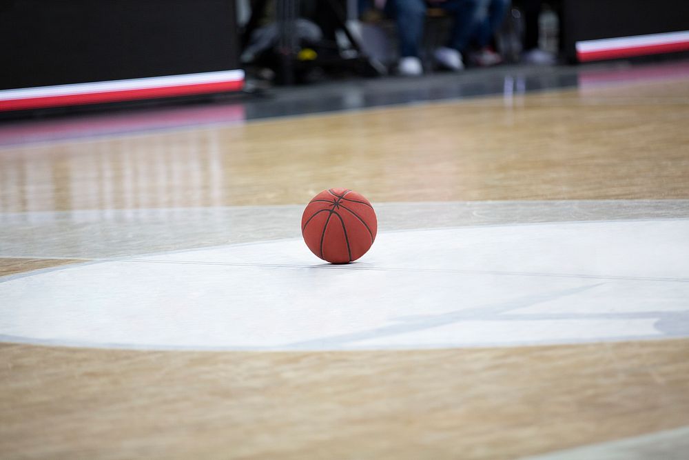 Basketball lying in the court