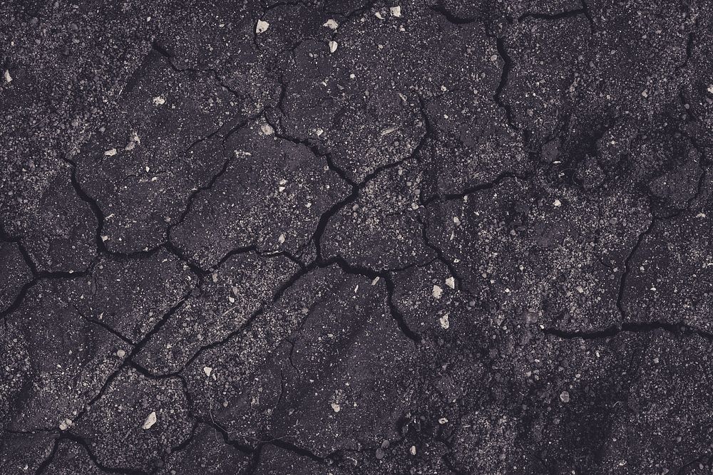 Cracks on a black concrete wall