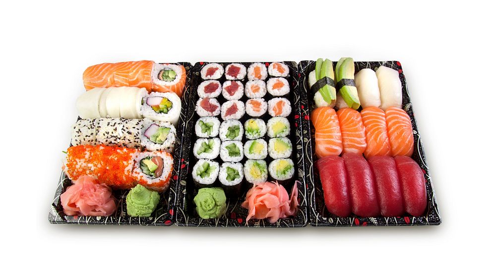 Set of sushi rolls and sashimi in a box