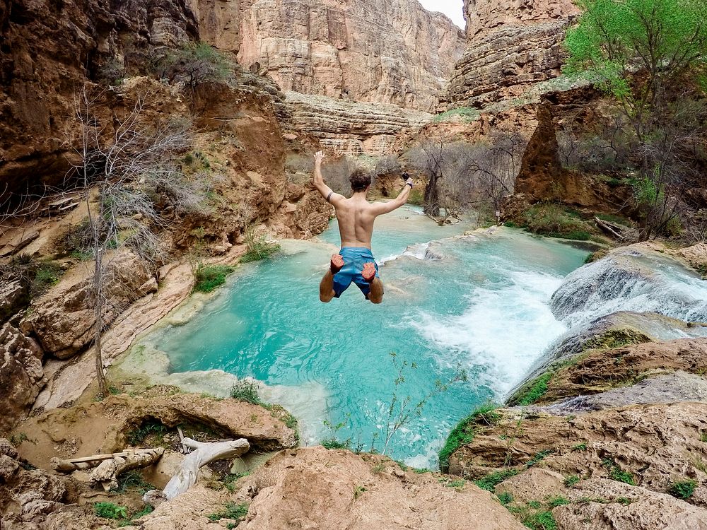 Man cliff diving in the Grand Canyon area