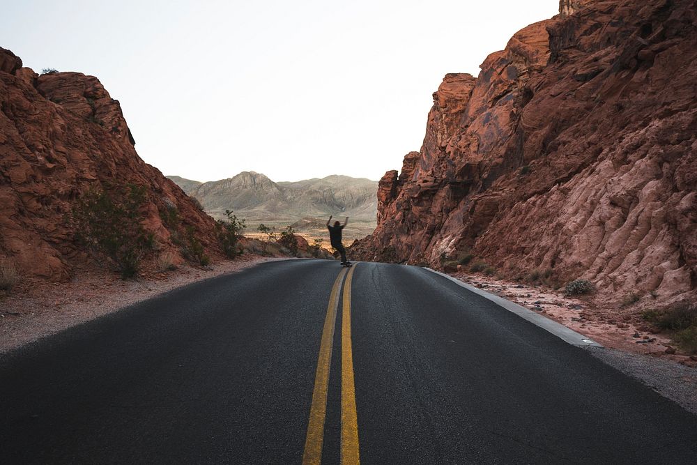 Man skating on the road in Valley of Fire State Park, Overton, United States