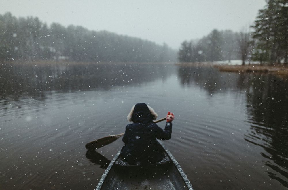 Paddling alone in the lake at Adirondack mountains