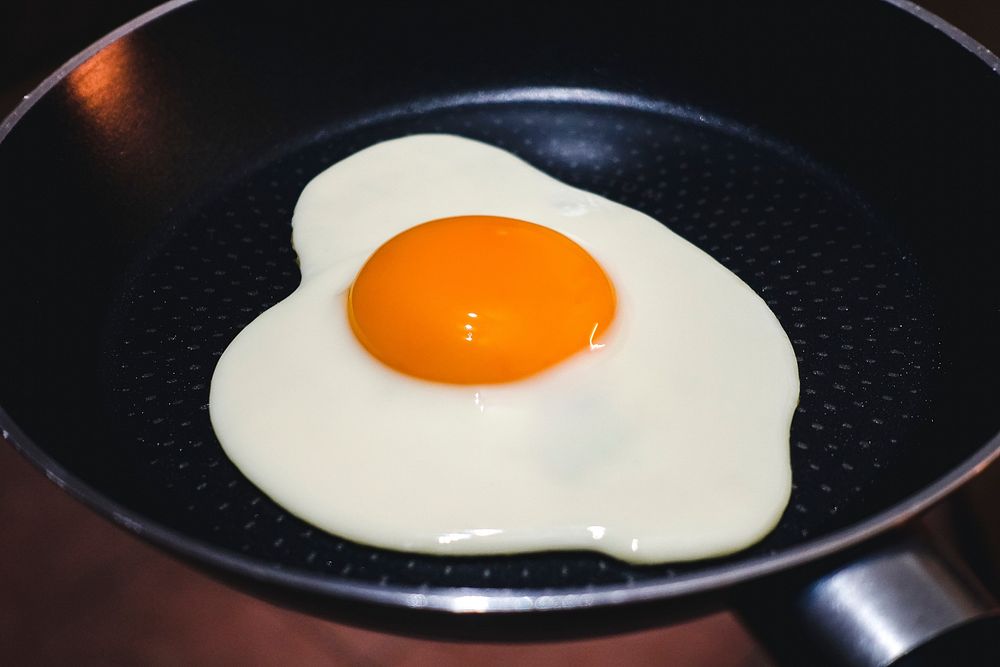 Sunny-side up fried egg on panfood photography