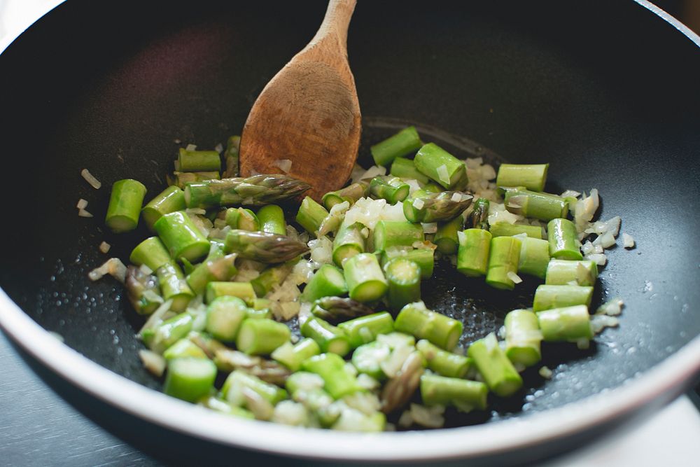 Asparagus and onion in a skillet