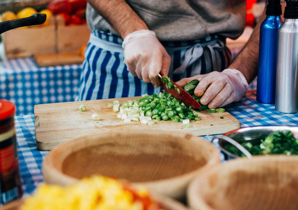 cook-chopping-spring-onion-on-a-wooden-free-photo-rawpixel