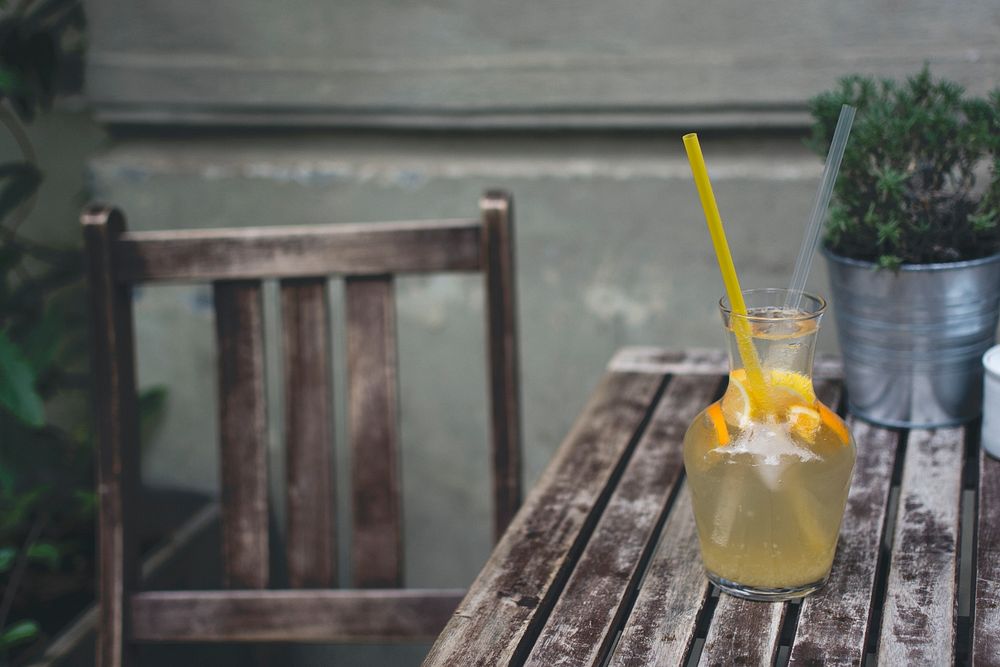 Orange lemonade on a wooden table