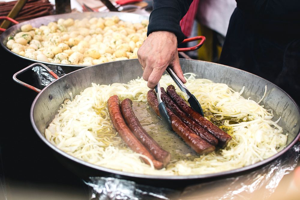 Sausages with onion at a market