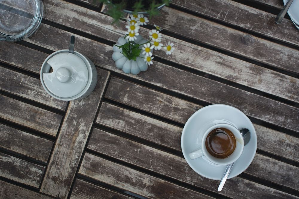 A cup of espresso on a wooden table