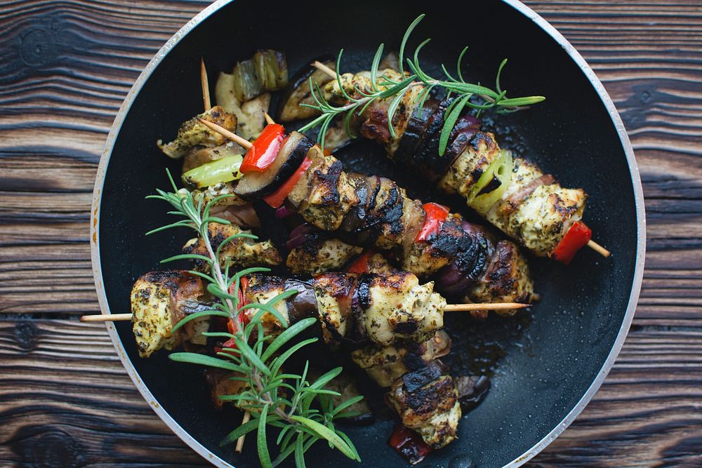 Chicken skewers on a wooden table