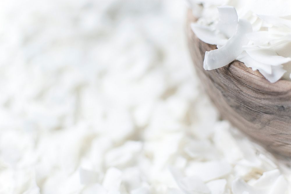 Shredded coconut in wooden bowl