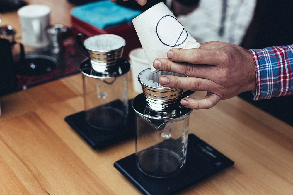 Demonstrating how to make pour over coffee
