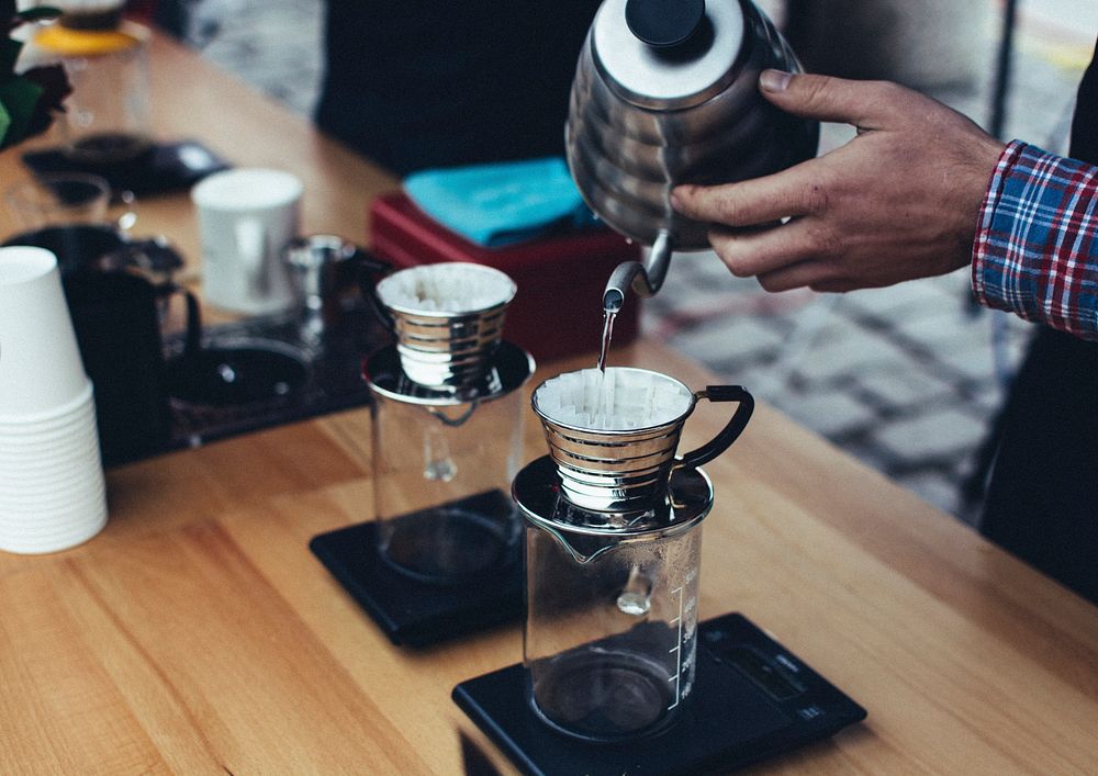 Demonstrating how to make pour over coffee