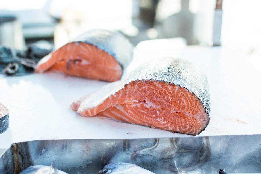 Salmon fillets being sold in a fish market