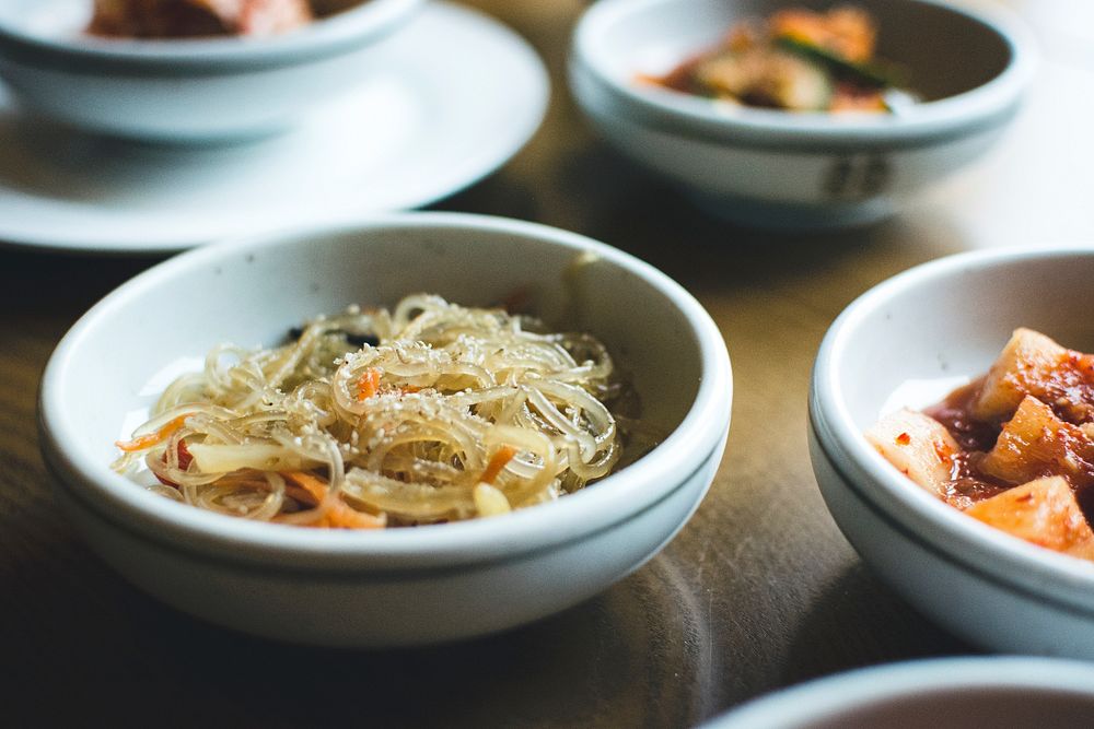 Korean meal with a dish of Korean glass noodle 