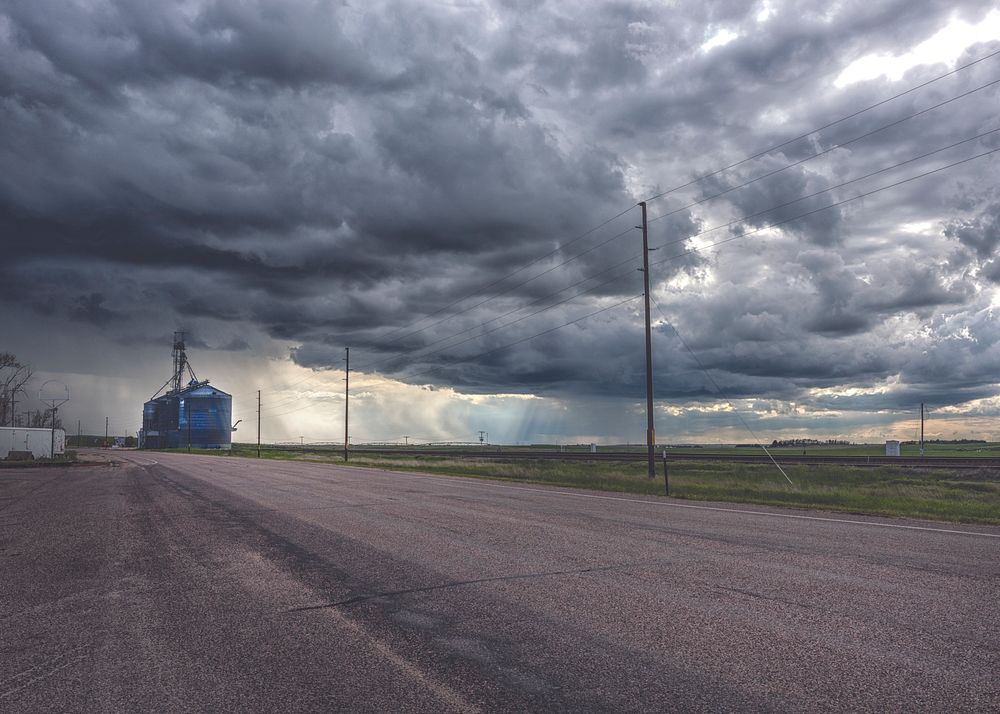 Ominous clouds above Pine Bluffs, a small farming community on the Nebraska border in Laramie County, Wyoming. Original…