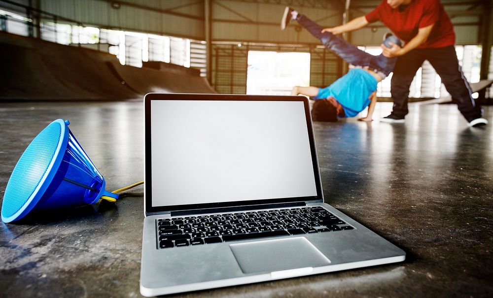 Laptop with an empty screen playing music for breakdancers