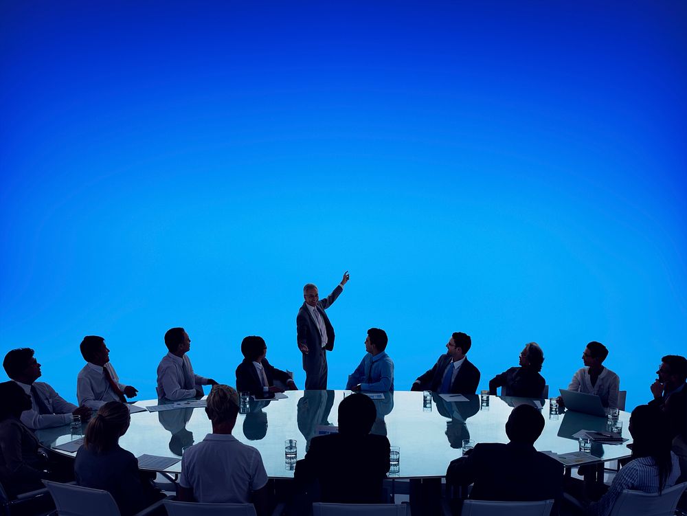 Silhouette of business people in a meeting and copyspace