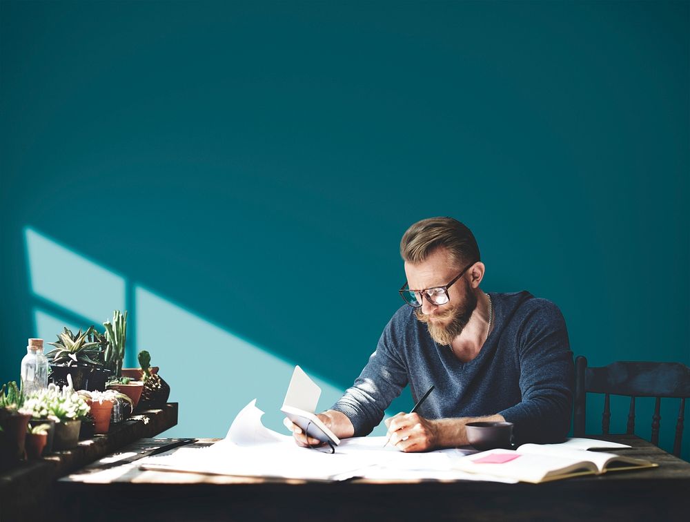 Hnadsome man working in a room