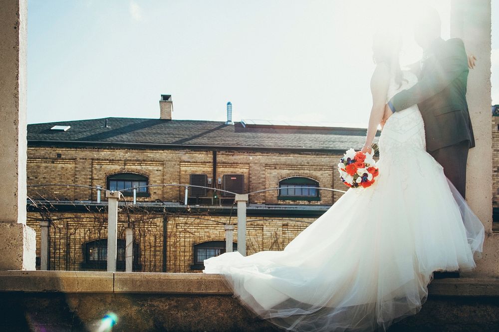 Free bride holding flower bouquet image, public domain CC0 photo.