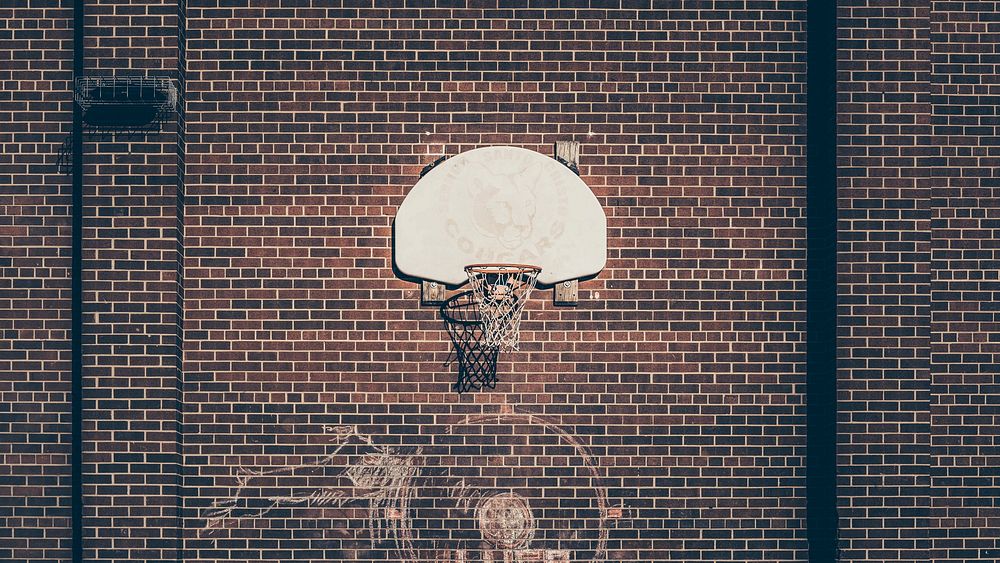 Free basketball goal on brick wall photo, public domain sport CC0 image.