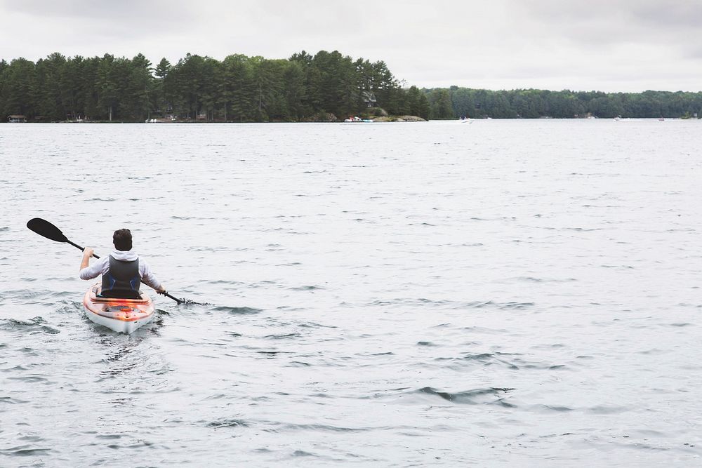Free man kayaking in the sea  image, public domain CC0 photo.