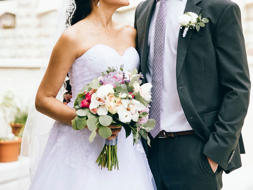 Free bride holding flower bouquet image, public domain CC0 photo.