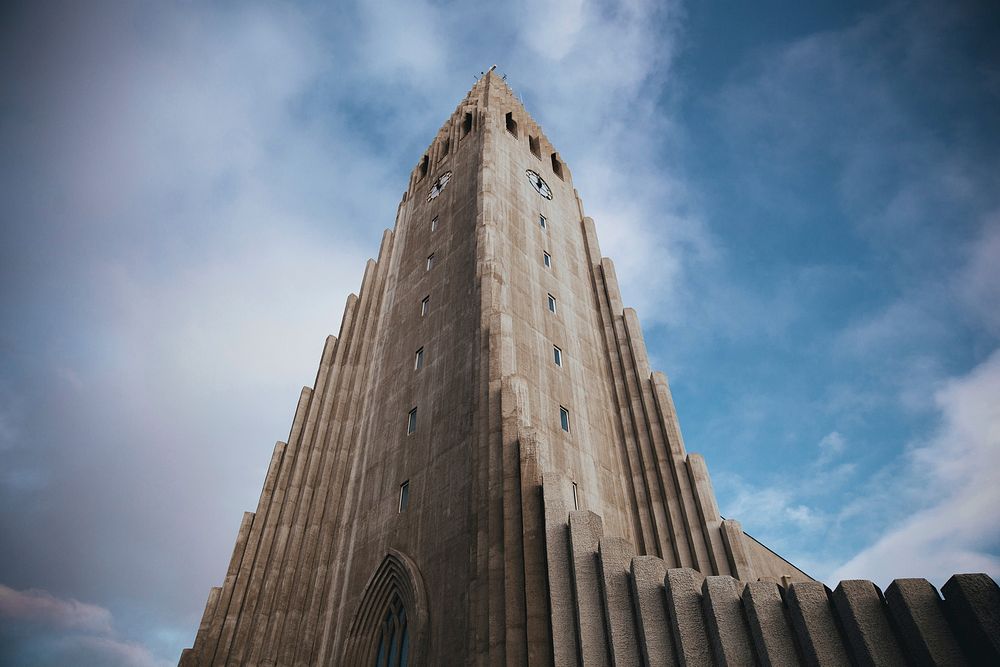 Free bottom view of a concrete clock tower in Iceland image, public domain CC0 photo.