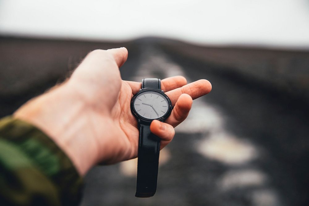 Free person holding watch photo, public domain accessory CC0 image.