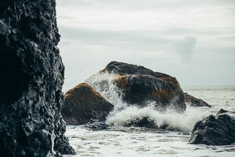 Free waves splashing hard on the rocks in the ocean public domain CC0 photo.