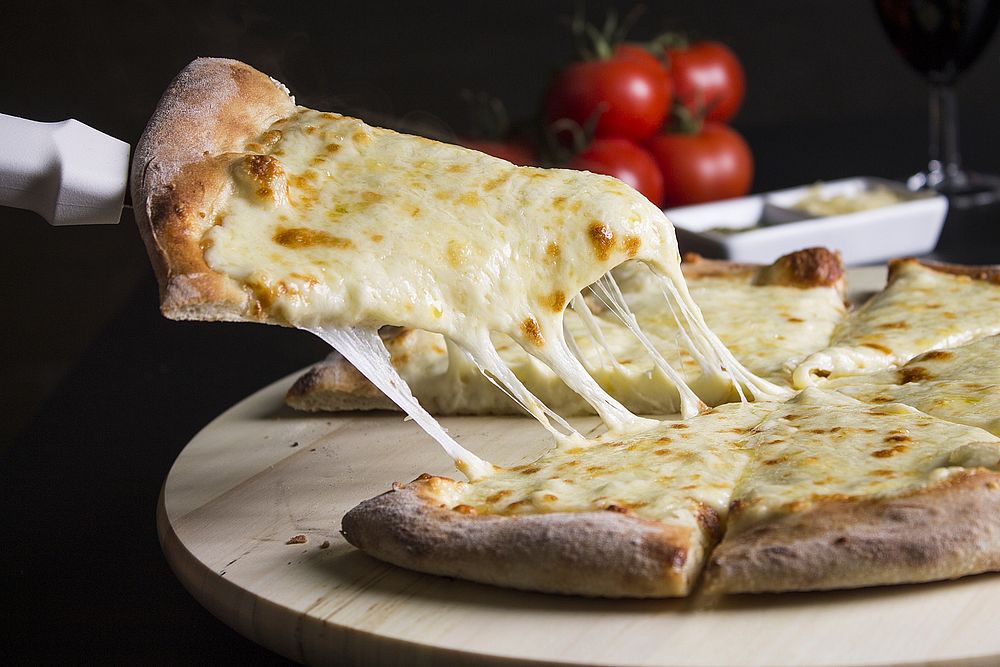 Free cheesy pizza close up image, public domain food CC0 photo.