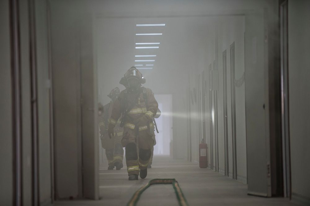 U.S. Air Force firefighters assigned to the 332d Expeditionary Civil Engineer Squadron clear rooms after responding to a…